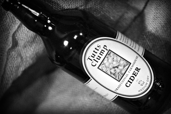 Tutts Clump Traditional Farmhouse Cider, shot of bottle with sack in the background. Yum.